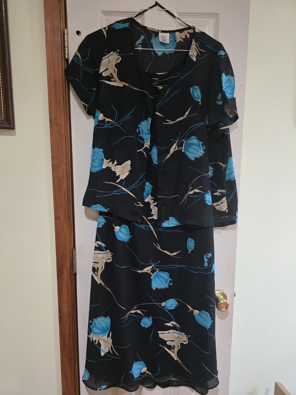 Preview International Black Garment with Teal and Beige Accents